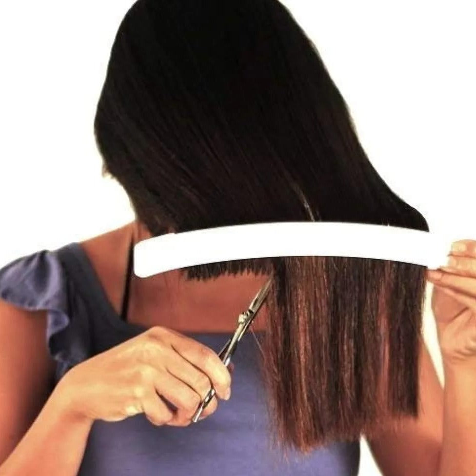 A Girl is Cutting Hair Using Scissors and  Hair Cutting Tool For Bangs.