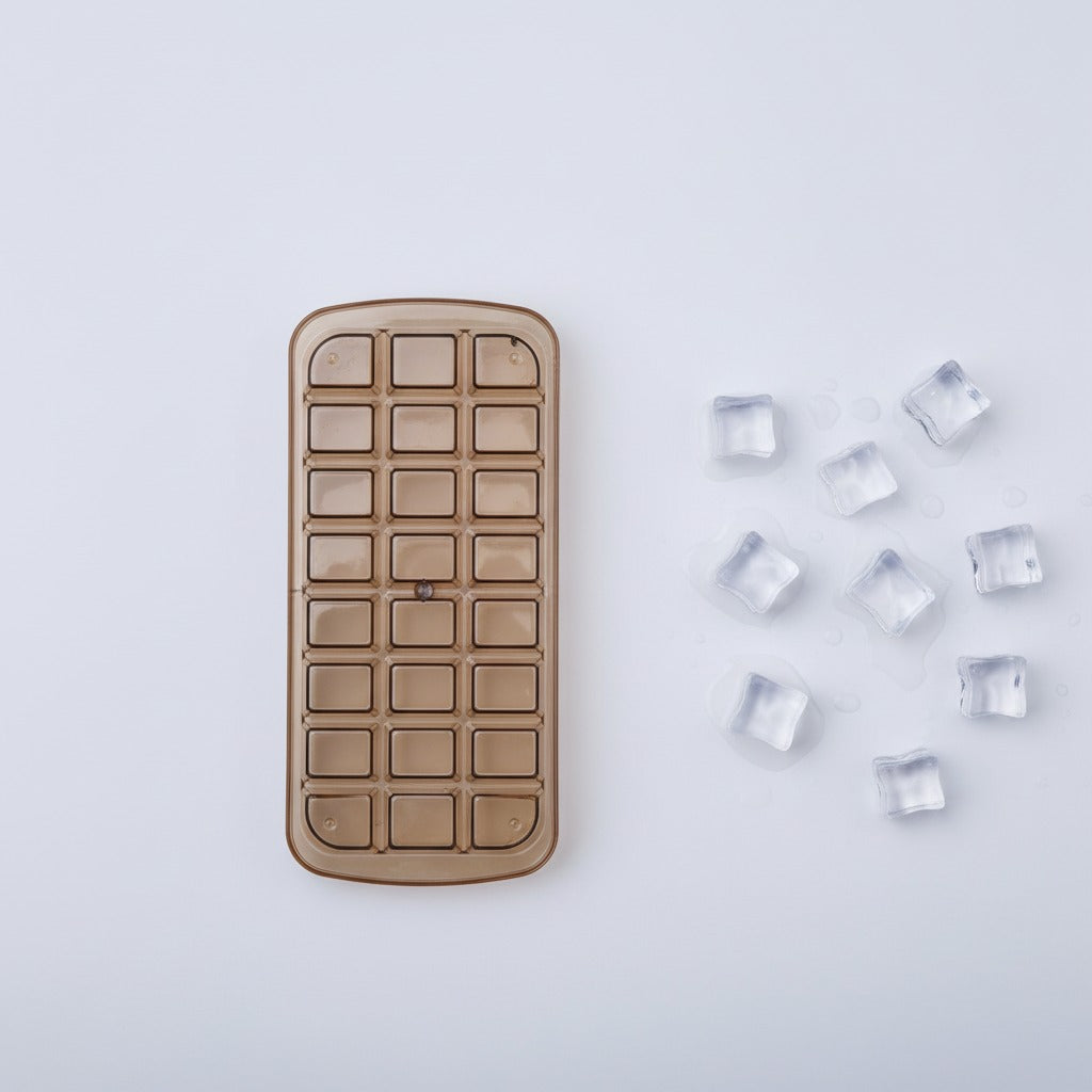 Ice cube tray with clear ice cubes on a light gray background