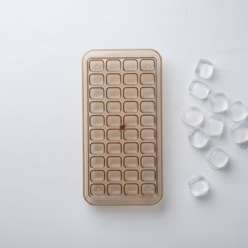 Ice cube tray with ice cubes on a white background