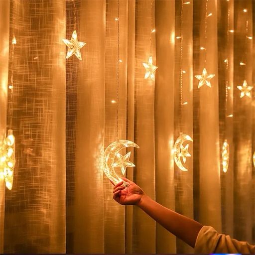 lady holding Moon Star Curtain Lights
