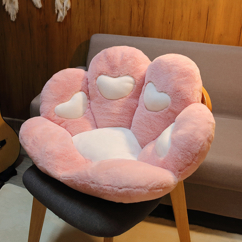 Pink cat paw cute cushion on chair