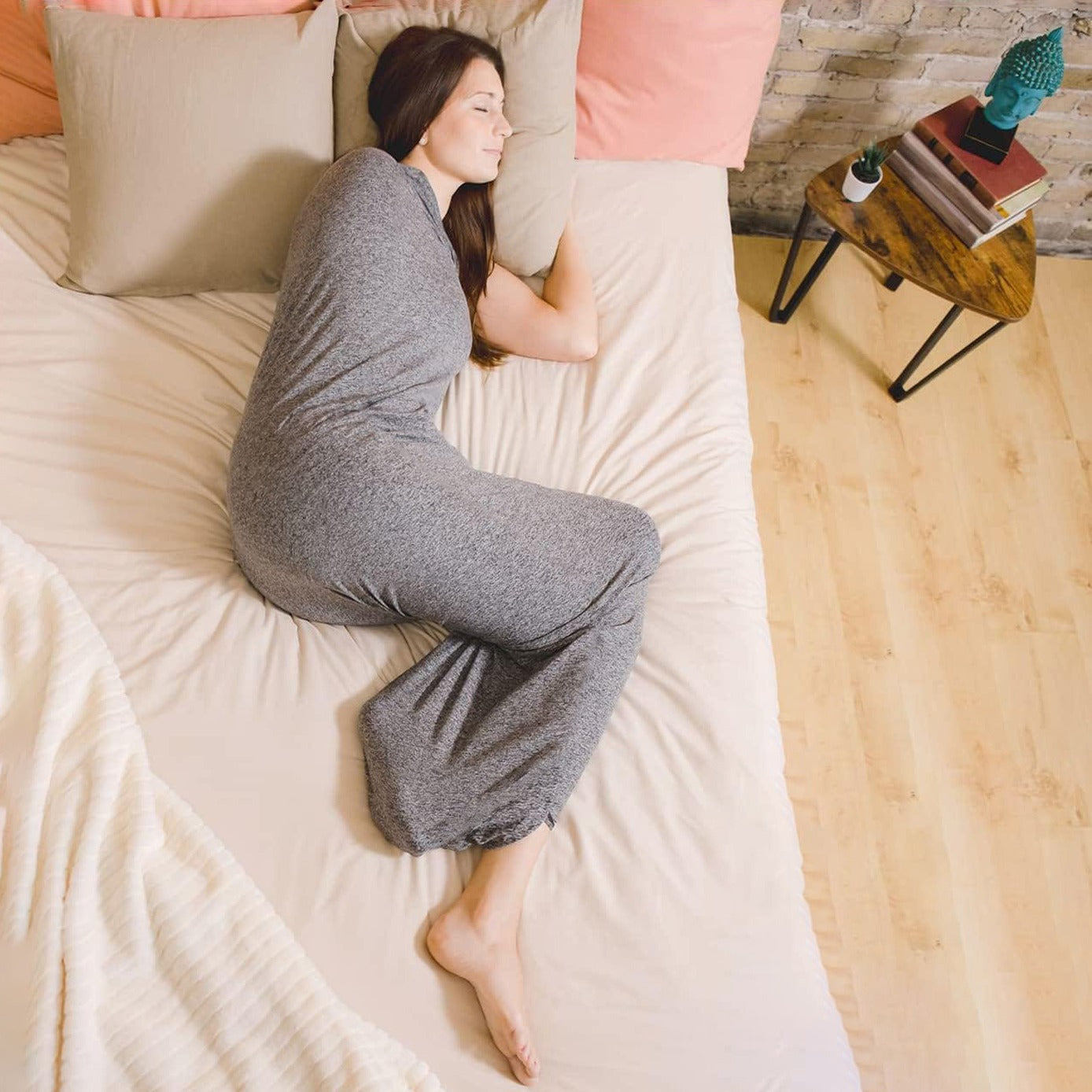 A Women Sleeping in a Wearable Sleep Pod.