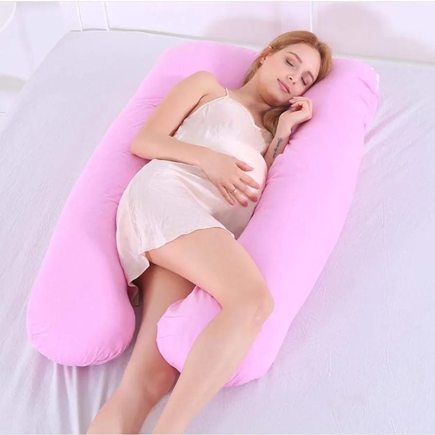 Woman relaxing with maternity pillow