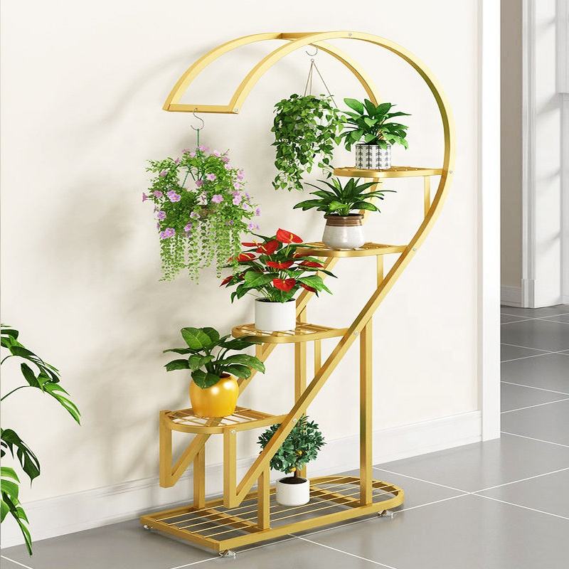 multi-tier plant stand with curved spiral design, featuring multiple shelves and hanging hooks displaying indoor potted plants and hanging planters.