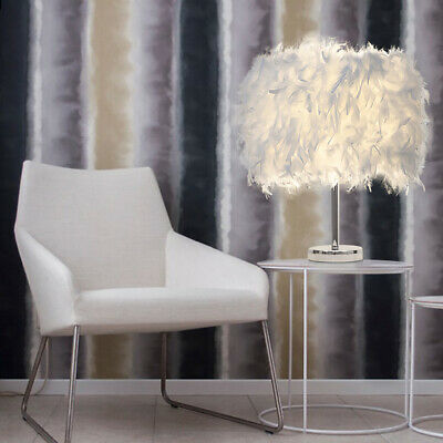 A Feather Shade Table Lamp is placed on the table next to the chair