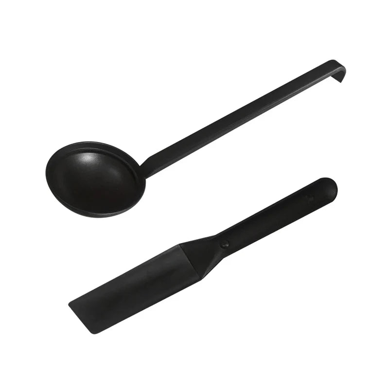 A black ladle and spatula set 