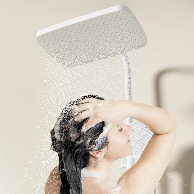 Girl is Bathing under Digital Display Rain Shower Set.