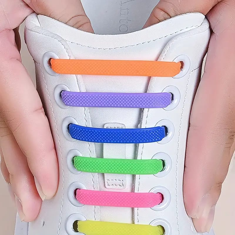 A Person is Holding Shoe Having Silicone No Tie Creative Shoelaces.