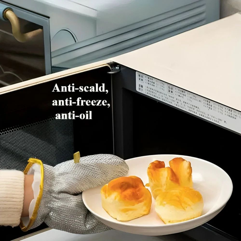 A Person is Taking Hot Plate from Oven Wearing Dishwashing Kitchen Cleaning Wire Gloves