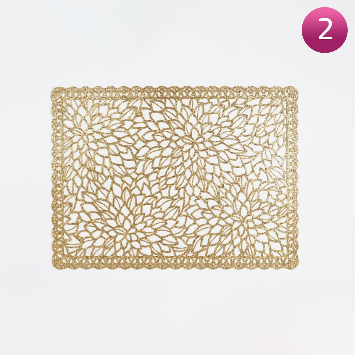 Decorative gold placemat with intricate leaf pattern on a white background