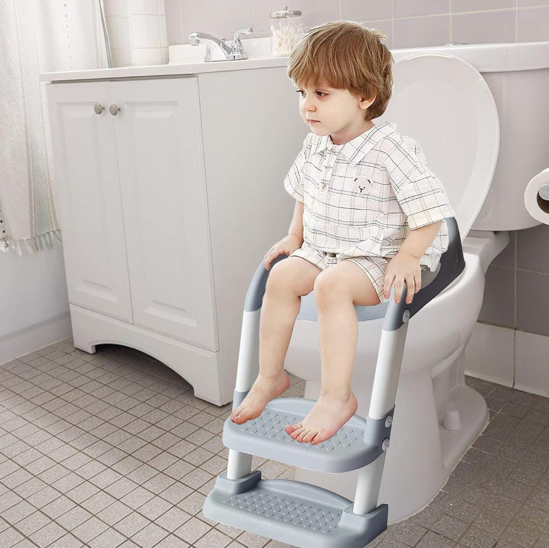 Child Sitting on the potty seat.