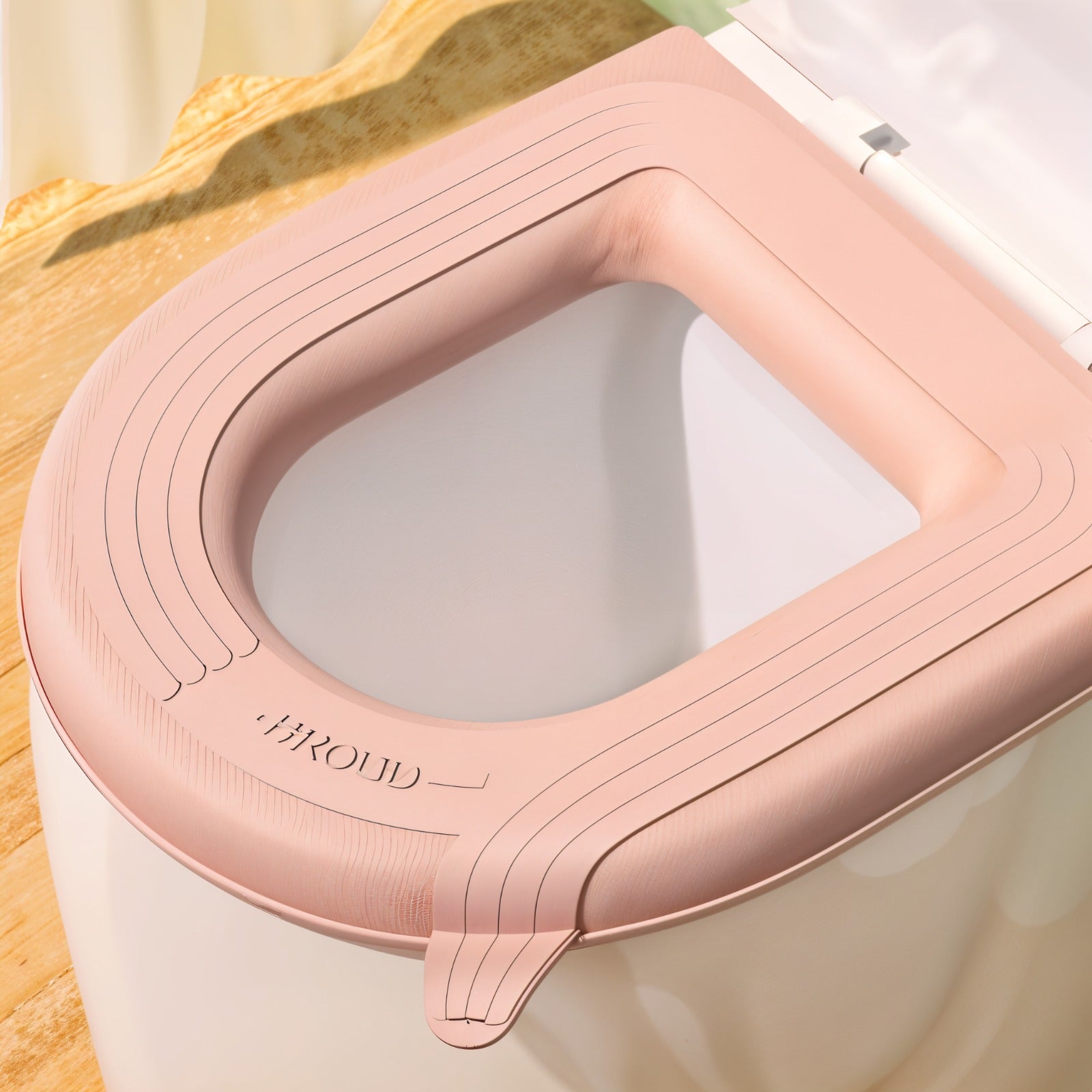 A padded toilet seat cover shown fitted on a toilet.