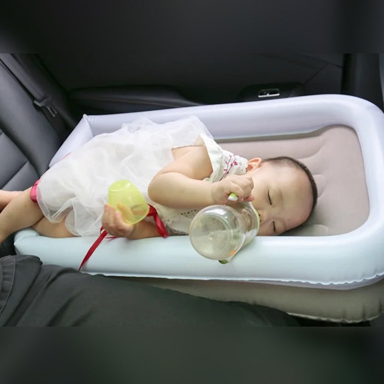 little baby sleeping by feeding herself in car