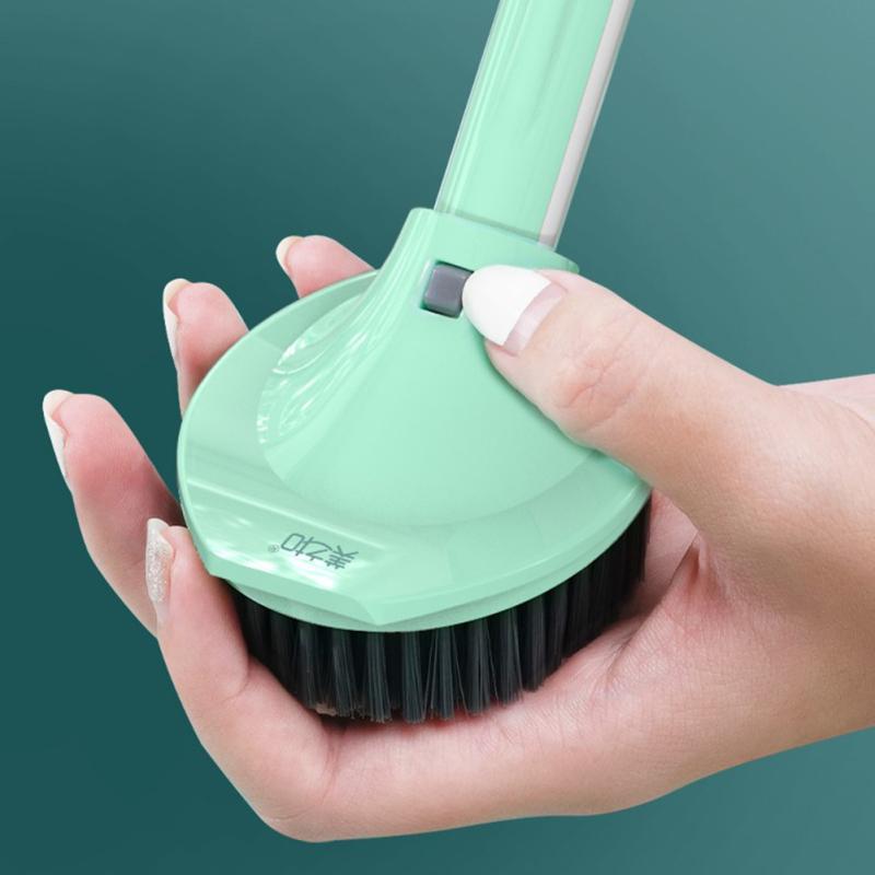 Someone holding a Long Handle Kitchen Dish Brush with Soap Dispenser