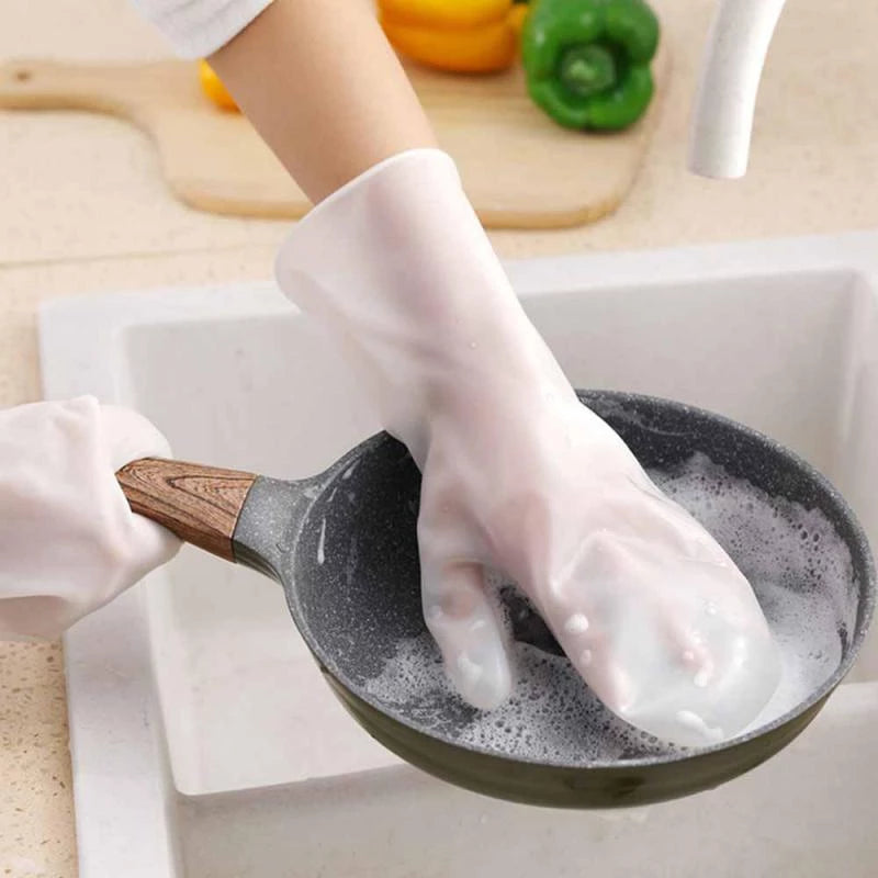 Someone cleaning a pan with the help of 1 pair of silicone gloves for dishwashing
