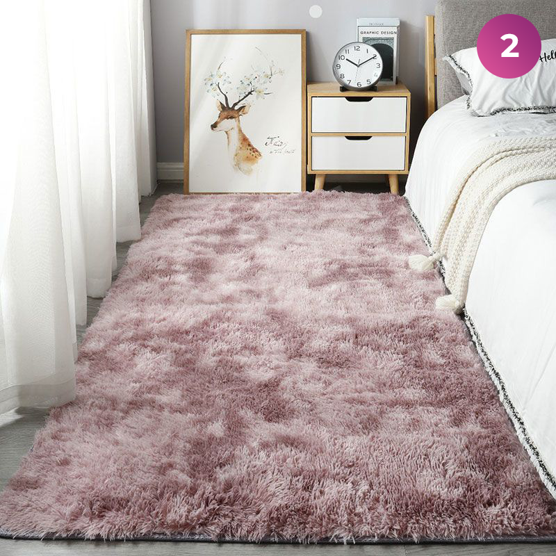 An Ultra Soft Indoor Rug is placed in a room next to the bed