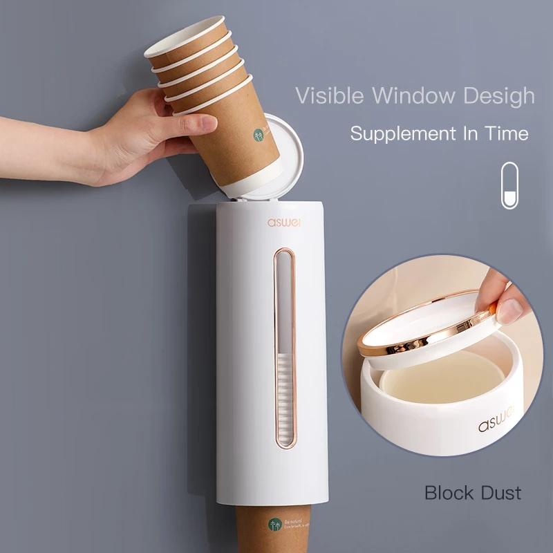 A person taking a cup from a Wall Mounted Disposable Cup Storage