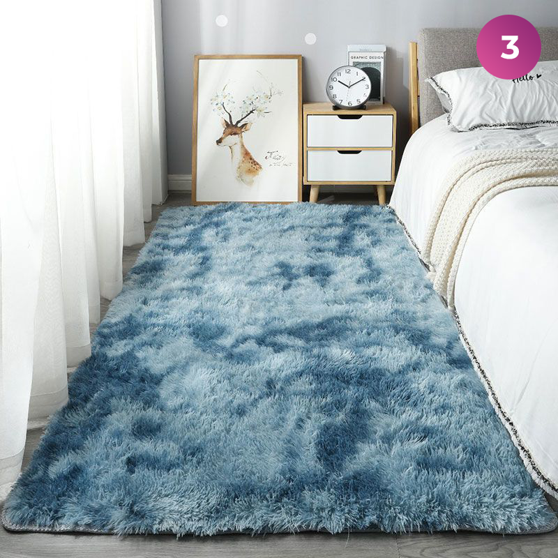 An Ultra Soft Indoor Rug is placed in a room next to the bed