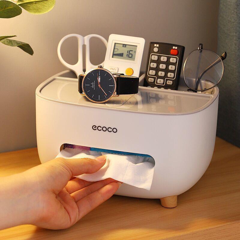 Remote, scissors, watch, Specs, Pen and A tissue placed together inside a Tissue Organizer Box with Remote Control Storage