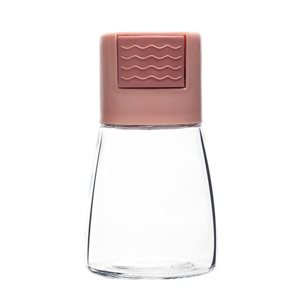 Someone using the Measurable Mini Salt Control Bottle in pink color