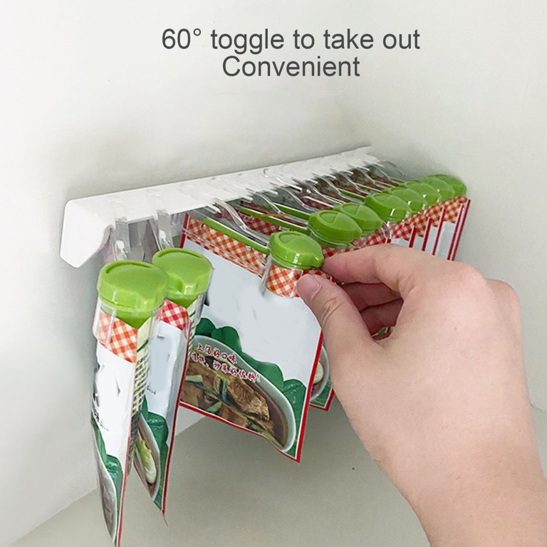 A person neatly organizes a bag of food on a 10 Clips Wall Mount Seasoning Bags Storage Rack