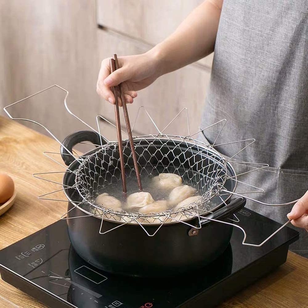 Someone cooking with the help of a Foldable Oil Drain Basket