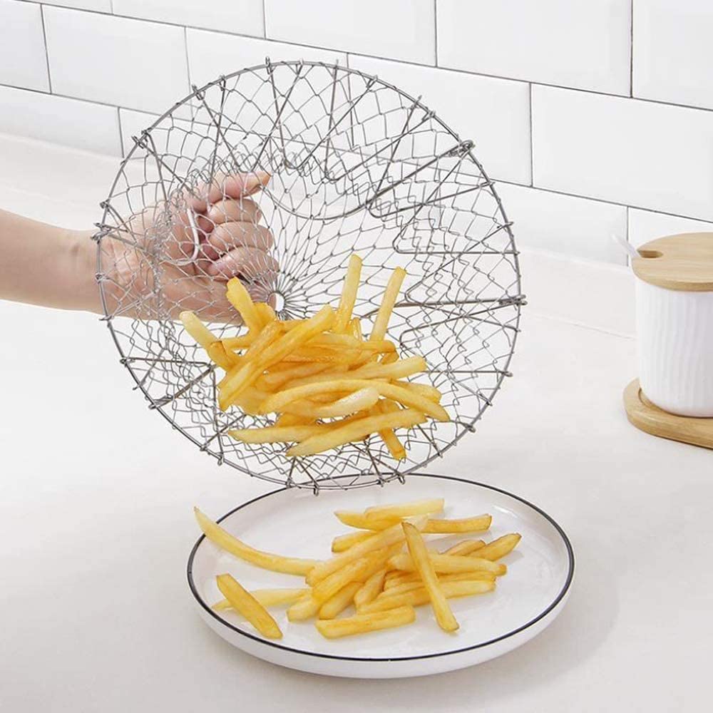 Someone pouring snacks into a Foldable Oil Drain Basket