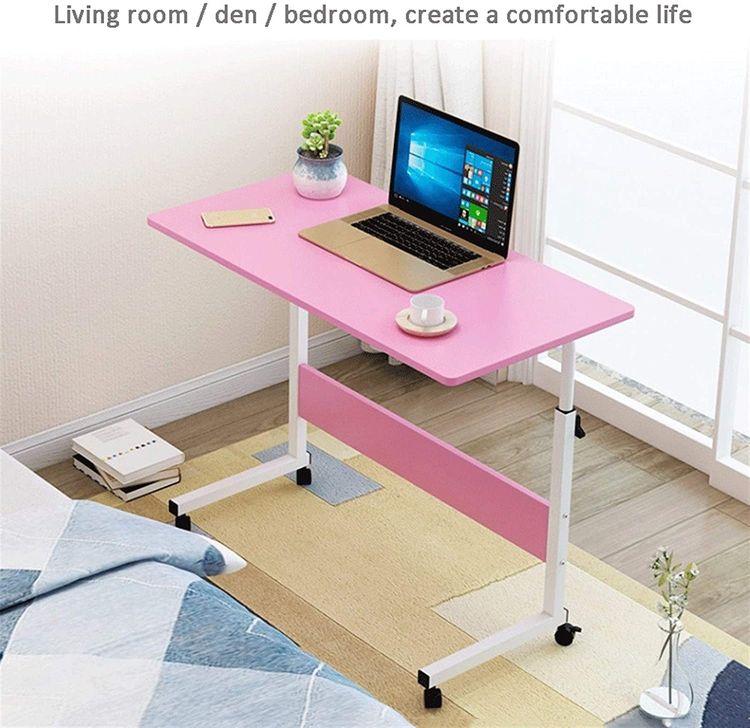 An Adjustable Movable Laptop Table with laptop kept on top of it ,placed beside a bed in a room