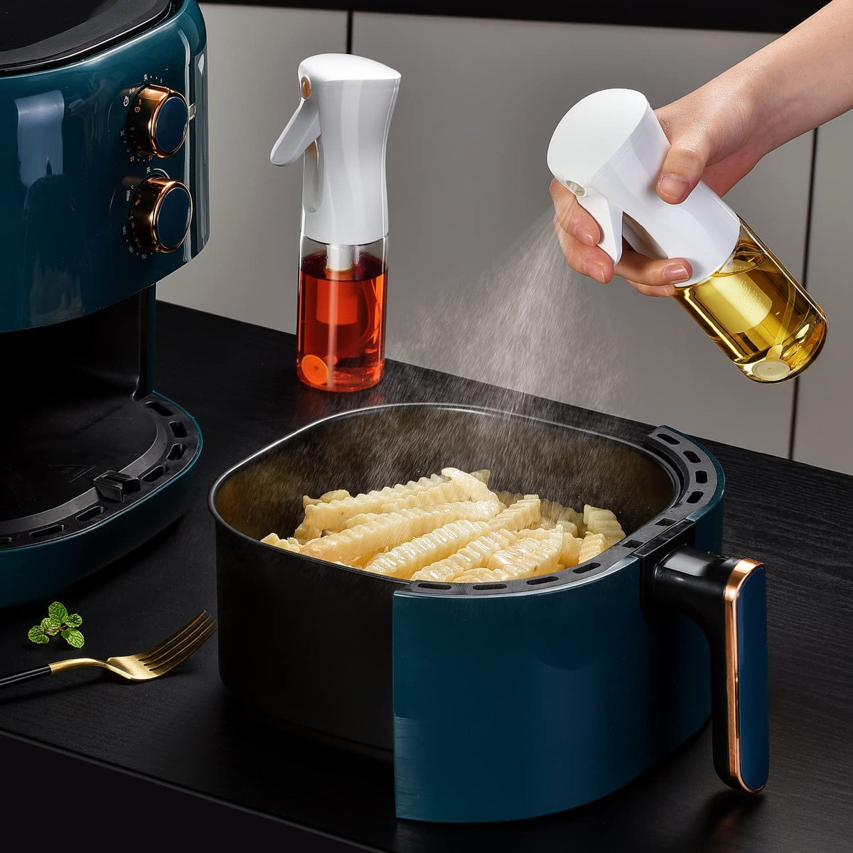 Someone is using a 200ml Kitchen Cooking Salad BBQ Oil Sprayer on food