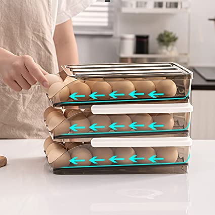 A person taking eggs from 3 Layer Auto Scrolling Stackable Egg Rack