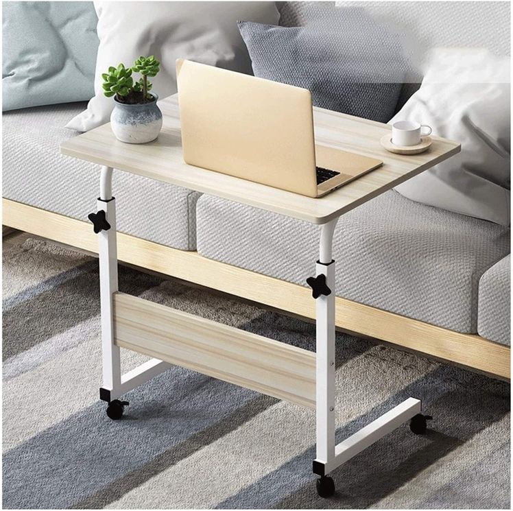 Oak Wood color Adjustable Movable Laptop Table placed beside to a sofa in a living room
