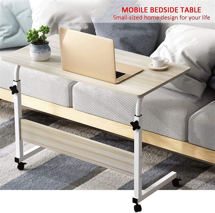 Oak Wood color Adjustable Movable Laptop Table placed beside to a sofa in a living room