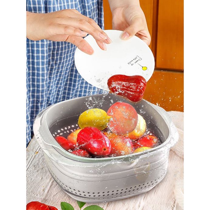 Someone is cleaning food from the Double Layer Vegetable Fruit Washing Drain Basket Storage