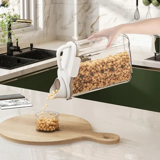 Someone is pouring something from a 2.8L Airtight Rice Grain Storage Container Food Dispenser into a cup