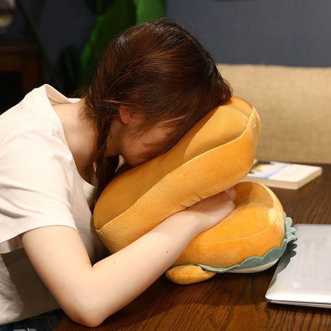 A girl is hugging a Washable Comfortable Cute Neck Pillow