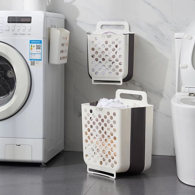 Collapsible Wall Mount Laundry Basket placed next to a washing machine