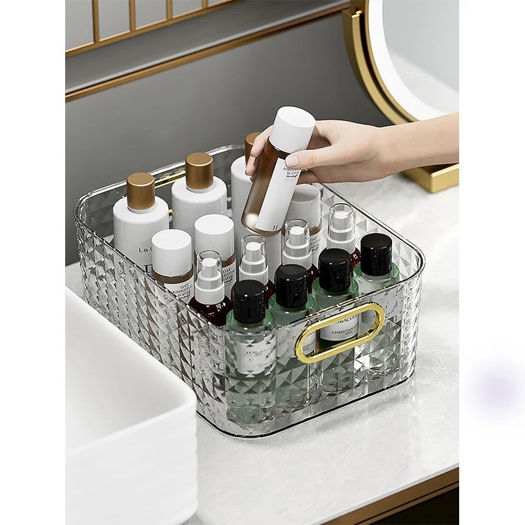 A hand putting a bottle into a  Portable Cosmetics Holder Storage Box