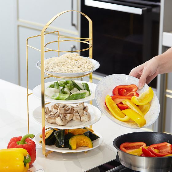 Someone is taking plates from the Multi-Layer Wall Mount Kitchen Side Dish Storage Rack