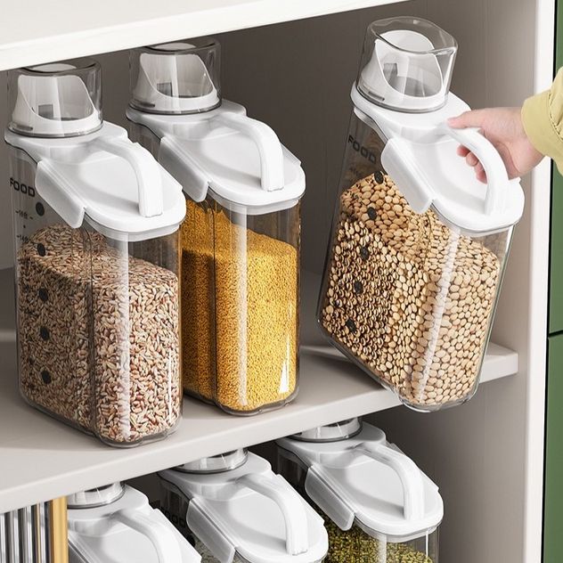 Someone is taking a 2.8L Airtight Rice Grain Storage Container Food Dispenser from the shelf