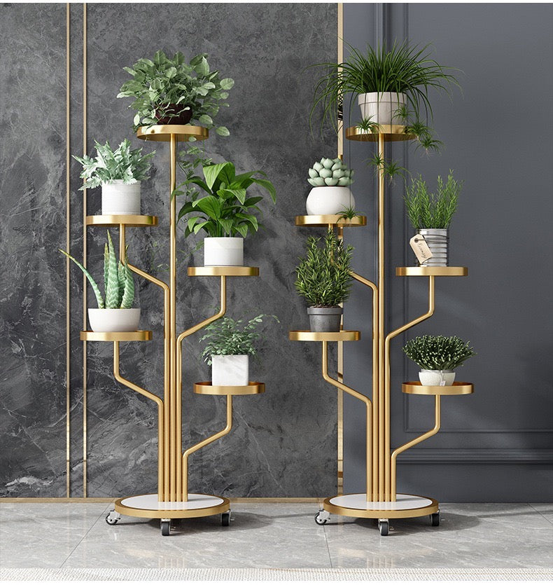 Two Golden color Indoor Plant Stands placed in a room along with plants