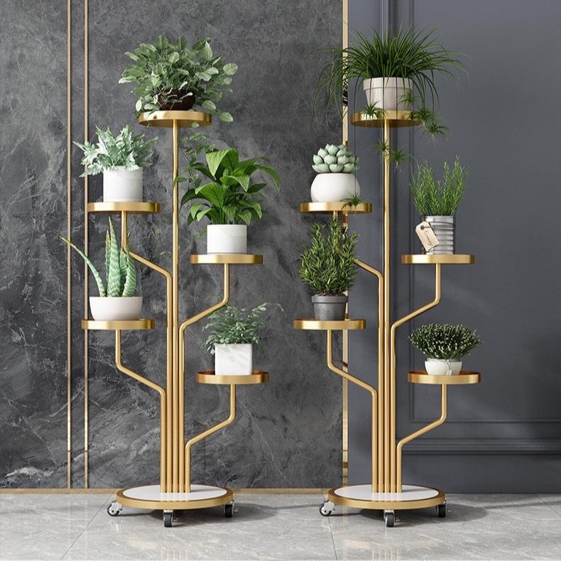 Two Golden color Indoor Plant Stands placed in a room along with plants