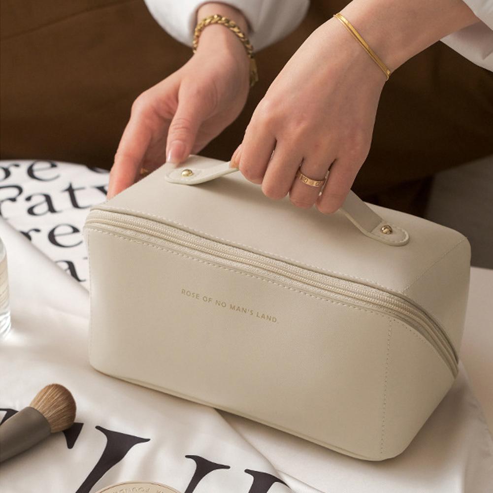 A lady holding Large Capacity Foldable Travel Cosmetic Bag 