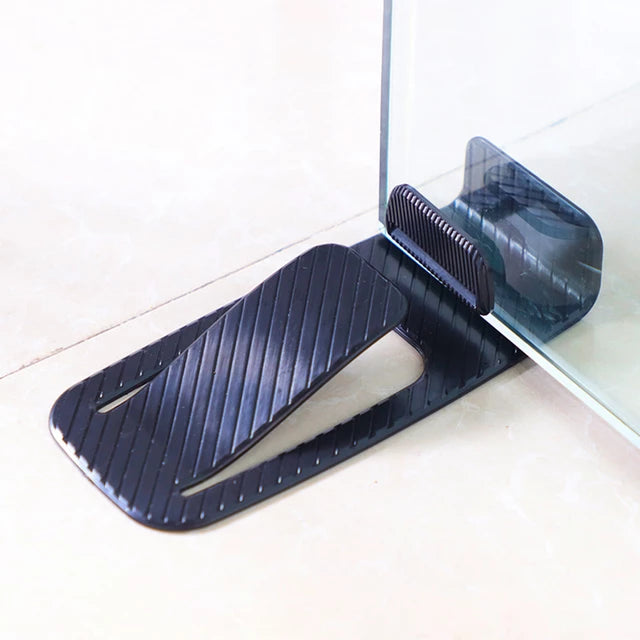 A glass door being held by an Innovative Door Stopper