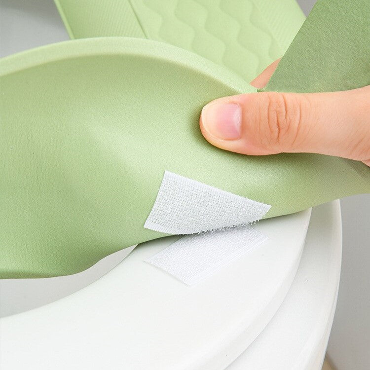 Close-up view of a toilet seat cover cushion pad
