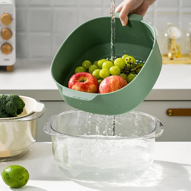 Someone is cleaning fruits with the help of the Double Layer Vegetable Fruit Washing Drain Basket Storage