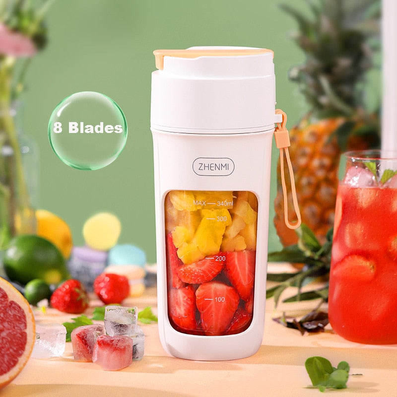 340ml Portable USB Rechargeable 8 Blades Stainless Steel Blender for Shakes placed next to some items