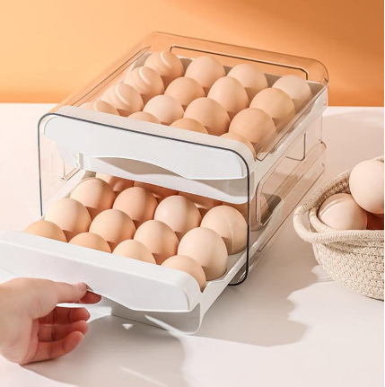 Someone placing a row into the Double Layer Egg Storage Drawer