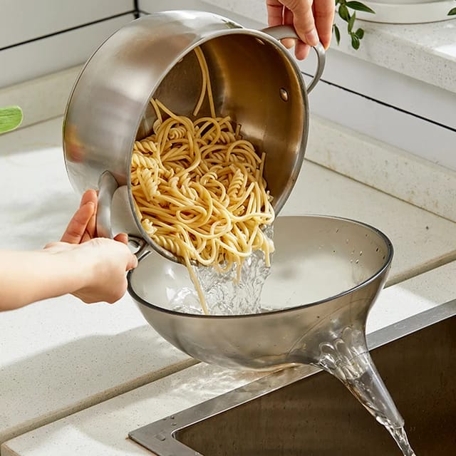 Someone putting food into a Multifunctional Kitchen Drain Bowl