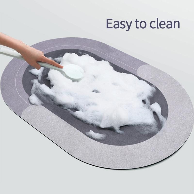 A person easily cleaning Bathroom Floor Mat with a brush 