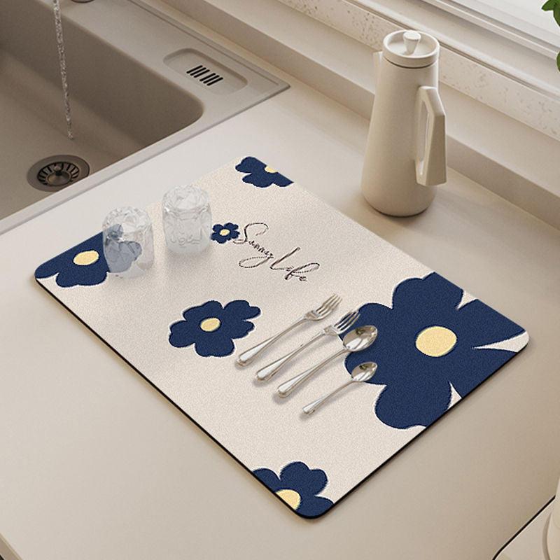 Showcasing Dish Drying Mat with spoons,forks and two glass cups kept on a kitchen counter top near to a sink